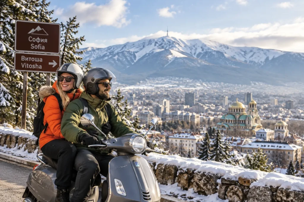Couple riding a scooter near Sofia with snow-covered Vitosha Mountain in the background